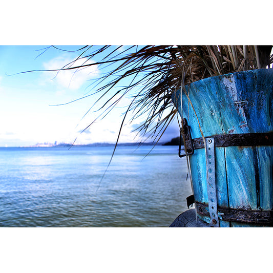 Photographic image by Jessica St. Clair depicting the view from Sausalito across the bay toward San Francisco, flanked by a beautifully aged weather-worn wooden planter painted in shades of ocean blue.