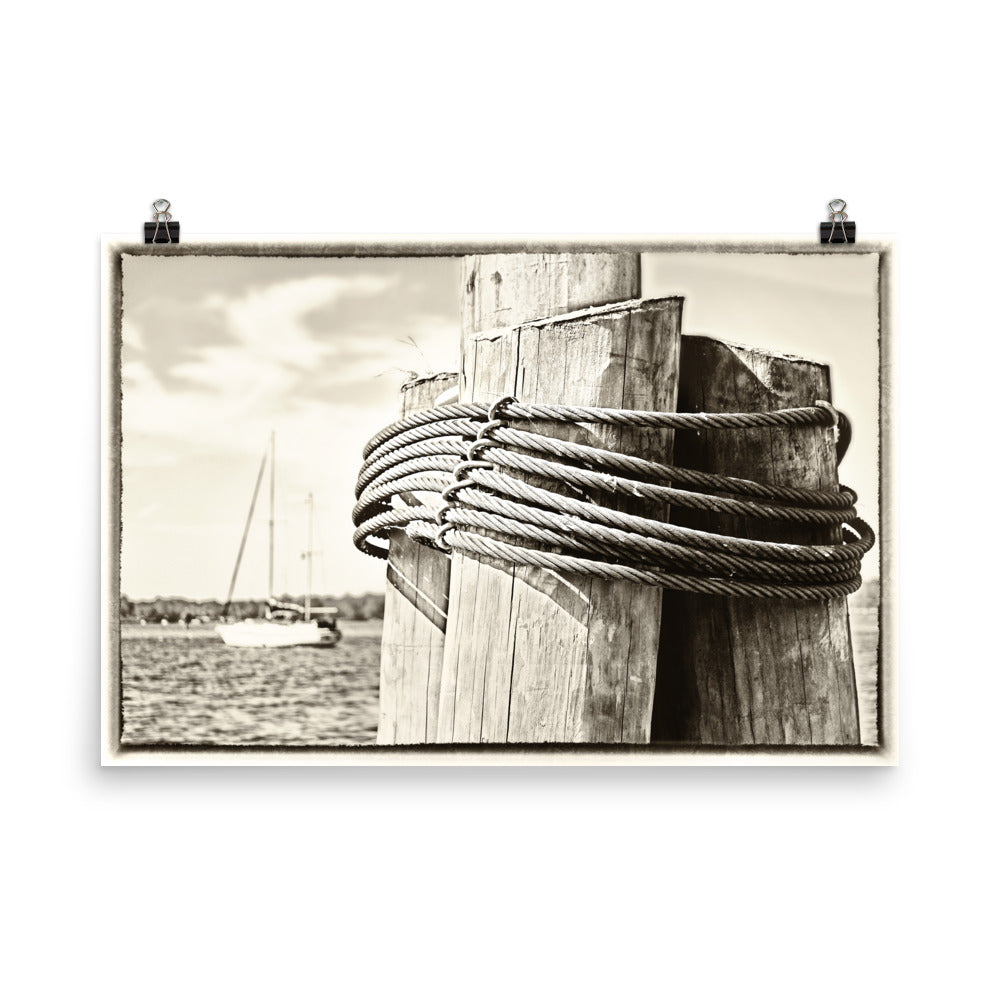 Image of Dockside mixed media sepia tone artwork on 24 inch by 36 inch enhanced matte photo paper by Jessica St. Clair depicting wood pilings and a sailboat at sea