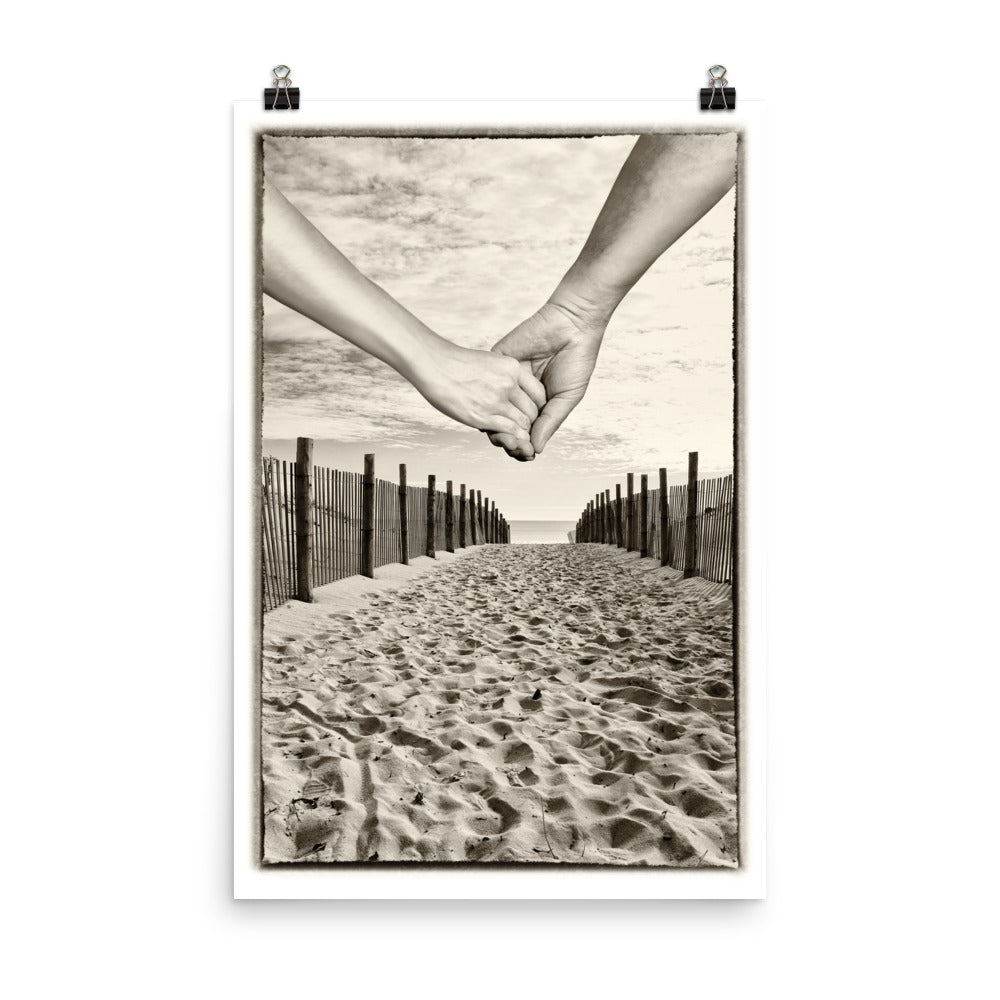 Image of The Journey mixed media sepia tone artwork on 24 inch by 36 inch enhanced matte photo paper by Jessica St. Clair depicting a couple holding hands as they walk down a sandy path that leads to the ocean