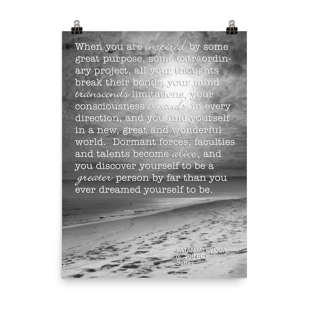 Image of 18 inch by 24 inch premium luster photo paper art print by Jessica St. Clair featuring black and white photography of footprints on the beach leading into the water with a Patanjali Yoga quote about the limitations one can transcend when inspired by great purpose overlaying the image