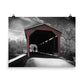 Image of Winter in Fair Hill 18 inch by 24 inch art print depicting a black and white winter scene with a man and dog in silhouette walking through a red covered bridge.