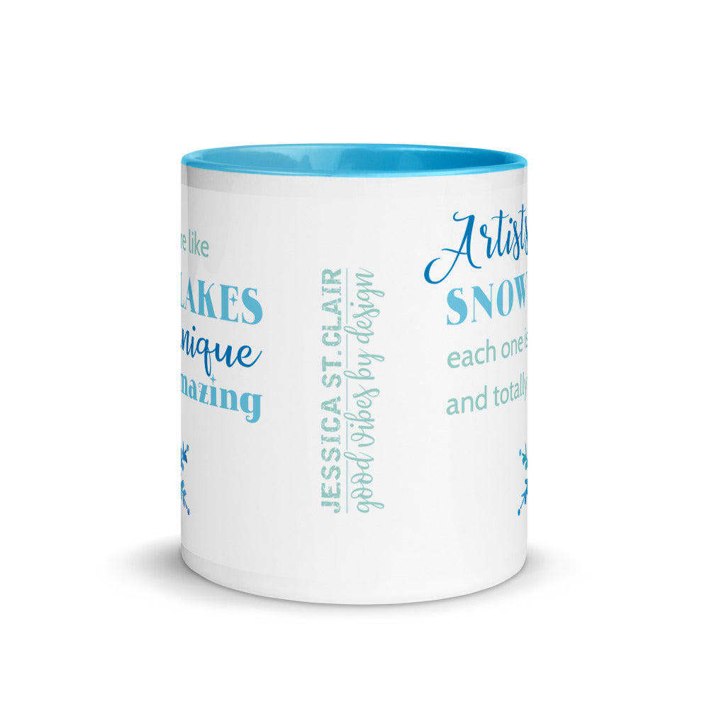 Image of center view of white ceramic mug featuring blue inside and handle with saying Artists are like snowflakes each one is unique and totally amazing