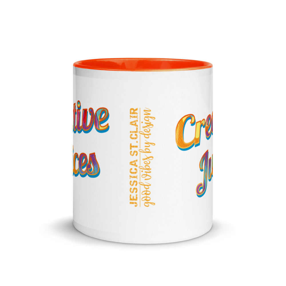 Image of center view of white ceramic mug featuring orange inside and handle and colorful words Creative Juices