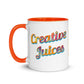 Image of back view of white ceramic mug featuring orange inside and handle and colorful words Creative Juices